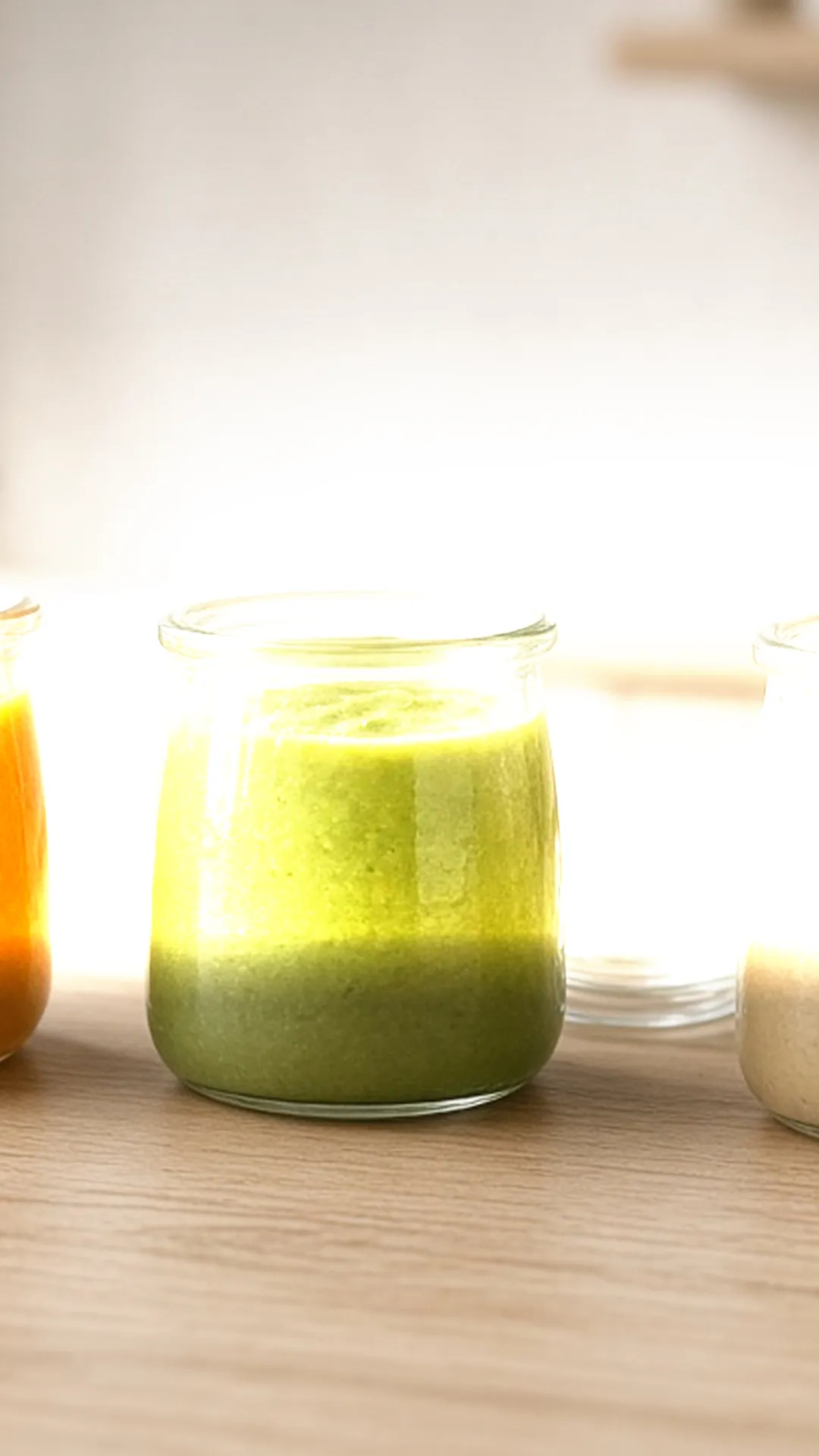 Small glass containers of vegetable purees with date labels